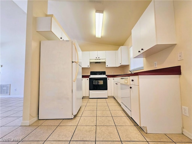 kitchen with visible vents, under cabinet range hood, white appliances, light tile patterned flooring, and white cabinets