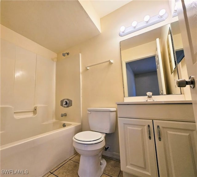 bathroom with tile patterned floors, toilet, bathtub / shower combination, and vanity