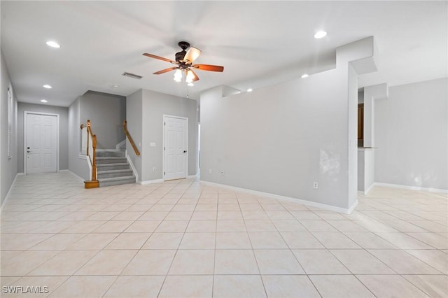 unfurnished living room with stairway, light tile patterned floors, a ceiling fan, visible vents, and recessed lighting