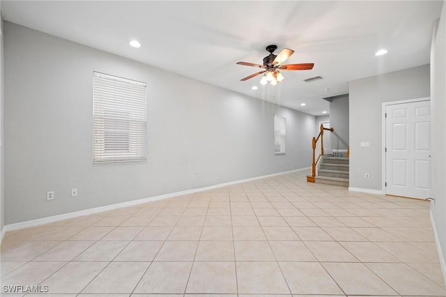 interior space featuring baseboards, visible vents, recessed lighting, ceiling fan, and stairs