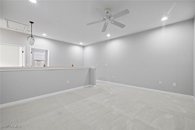 unfurnished room featuring recessed lighting, carpet, attic access, and ceiling fan