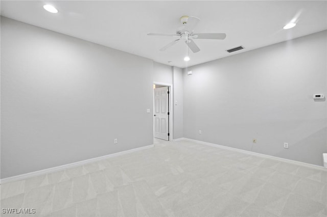 spare room with visible vents, baseboards, ceiling fan, light colored carpet, and recessed lighting