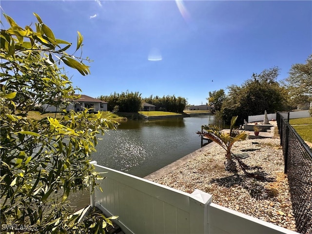 view of water feature featuring fence