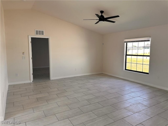 unfurnished room with visible vents, lofted ceiling, baseboards, and a ceiling fan