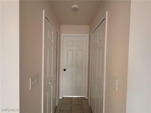 corridor featuring tile patterned flooring