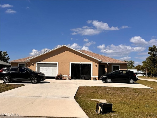 view of property exterior with concrete driveway, a lawn, a garage, and stucco siding