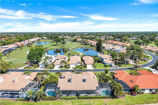 aerial view featuring golf course view, a residential view, and a water view