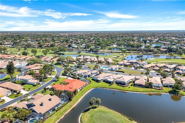 bird's eye view featuring golf course view, a residential view, and a water view