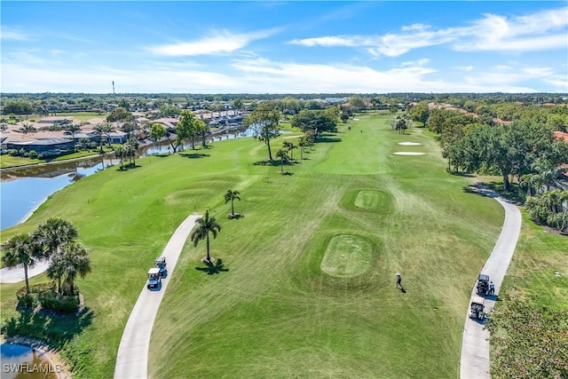 birds eye view of property featuring a residential view, golf course view, and a water view