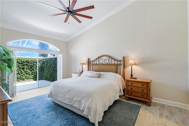 bedroom featuring a ceiling fan, wood finished floors, access to outside, lofted ceiling, and ornamental molding