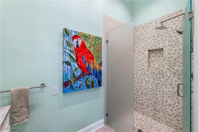 bathroom with a shower stall