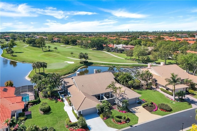 aerial view with a residential view, a water view, and view of golf course