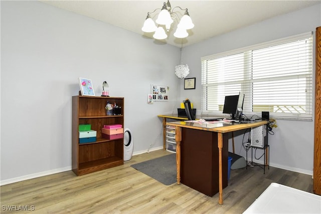 6102 Augusta Dr Unit 209, Fort Myers, FL 33907 - office area with baseboards, an inviting chandelier, and wood finished floors