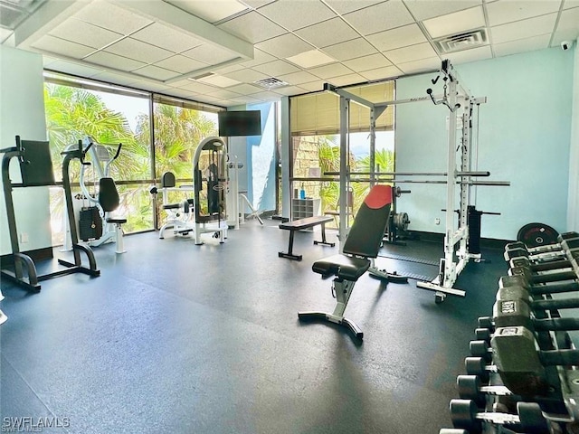 6102 Augusta Dr Unit 209, Fort Myers, FL 33907 - workout area featuring a wealth of natural light, visible vents, and a drop ceiling