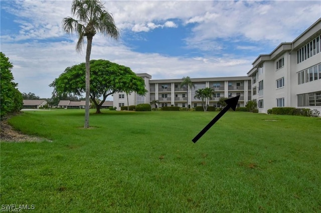 6102 Augusta Dr Unit 209, Fort Myers, FL 33907 - surrounding community with a lawn