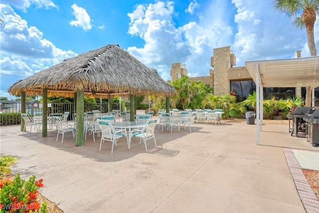 6102 Augusta Dr Unit 209, Fort Myers, FL 33907 - view of patio / terrace with area for grilling and fence