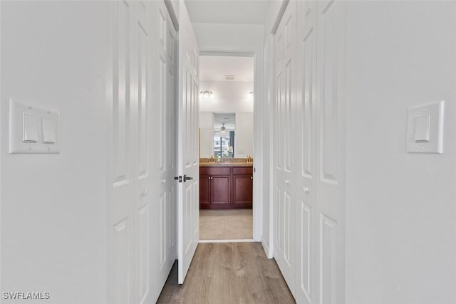 hallway with wood finished floors