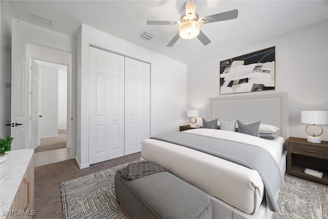 carpeted bedroom with visible vents, a closet, and ceiling fan