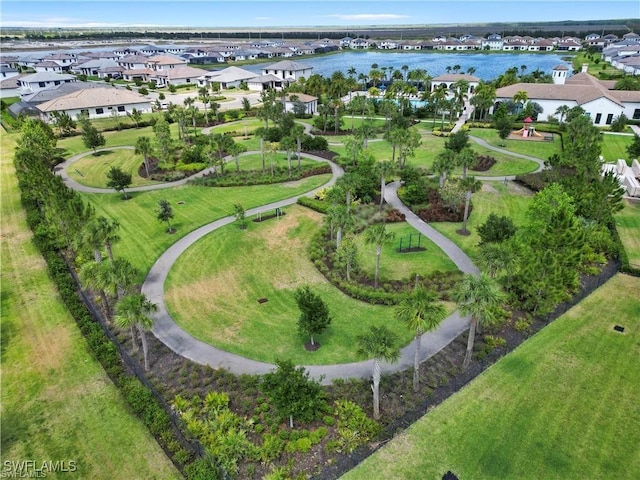 birds eye view of property featuring a residential view and a water view