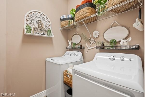 clothes washing area with laundry area and washing machine and dryer