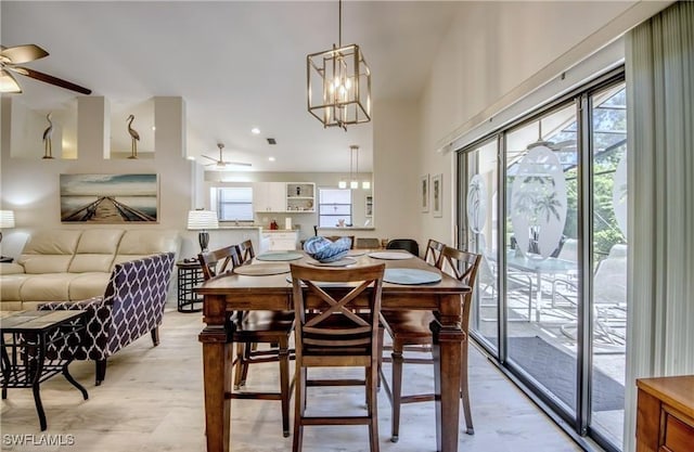 dining area featuring plenty of natural light, a ceiling fan, and light wood finished floors