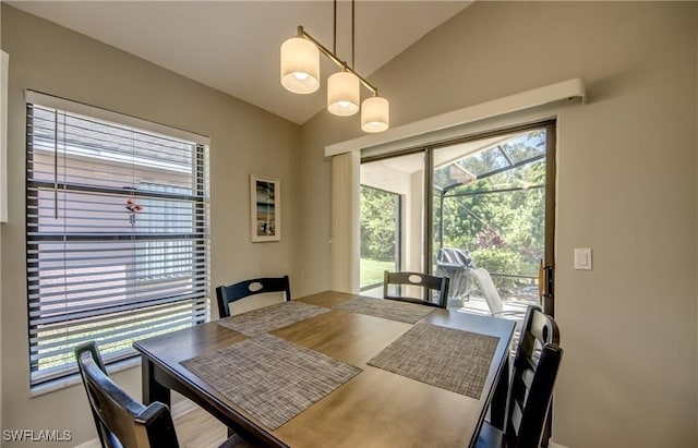 dining area with lofted ceiling