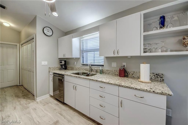 kitchen featuring open shelves, light wood-style flooring, a sink, white cabinets, and dishwasher