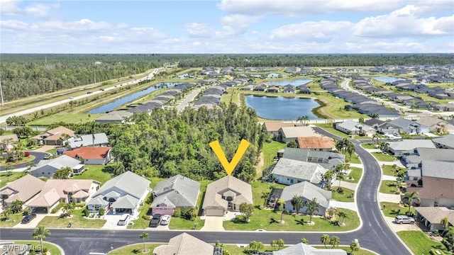 bird's eye view featuring a residential view and a water view