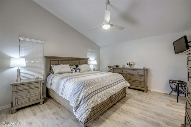 bedroom with high vaulted ceiling, light wood-style floors, baseboards, and ceiling fan