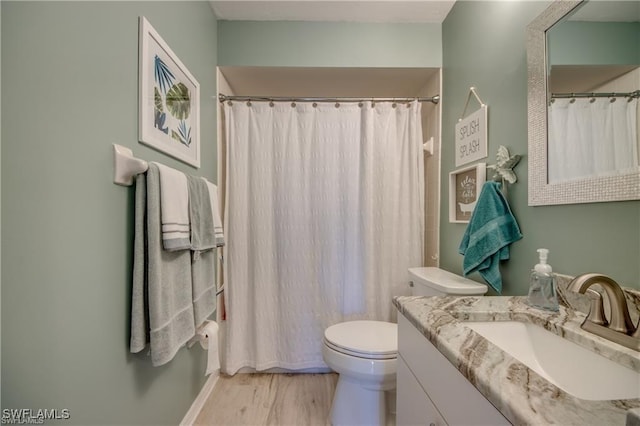 full bathroom with toilet, vanity, a shower with curtain, and wood finished floors