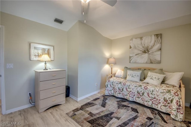 bedroom featuring visible vents, baseboards, a ceiling fan, and vaulted ceiling