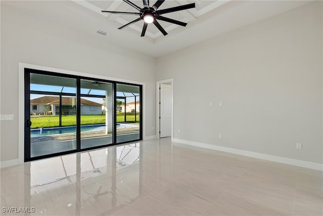 1912 SW 12th St, Cape Coral, FL 33991 - empty room featuring visible vents, baseboards, a high ceiling, and a ceiling fan