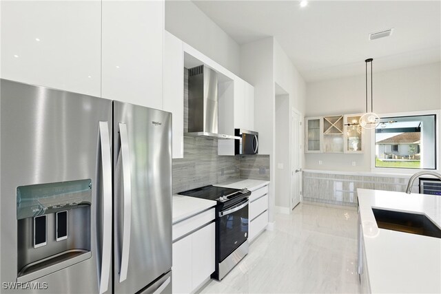 1912 SW 12th St, Cape Coral, FL 33991 - kitchen featuring wall chimney range hood, white cabinets, stainless steel appliances, modern cabinets, and a sink