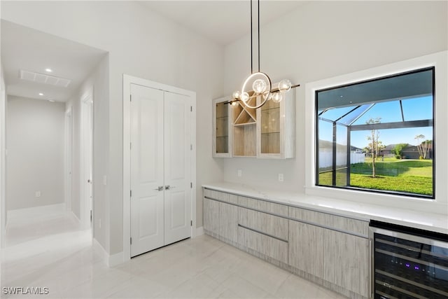 1912 SW 12th St, Cape Coral, FL 33991 - unfurnished dining area with recessed lighting, visible vents, wine cooler, and an inviting chandelier