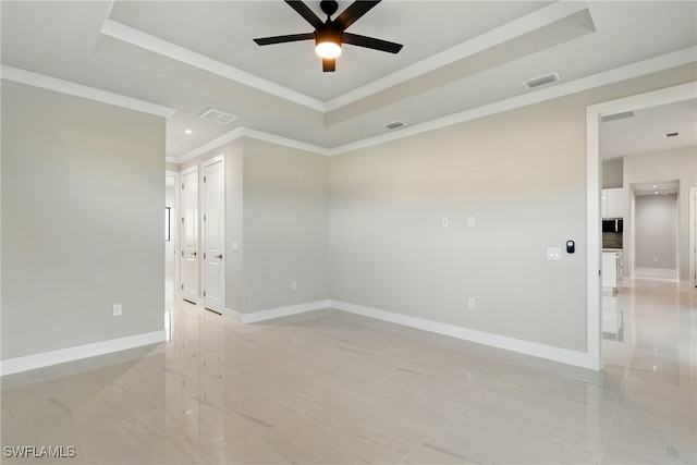 1912 SW 12th St, Cape Coral, FL 33991 - spare room featuring a tray ceiling, baseboards, visible vents, and ceiling fan