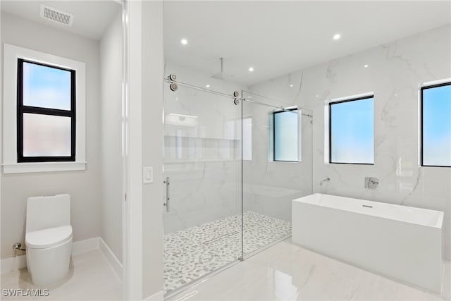 1912 SW 12th St, Cape Coral, FL 33991 - full bath featuring visible vents, toilet, marble finish floor, a marble finish shower, and a soaking tub