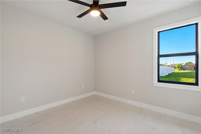 1912 SW 12th St, Cape Coral, FL 33991 - spare room with baseboards and ceiling fan