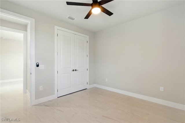 1912 SW 12th St, Cape Coral, FL 33991 - unfurnished bedroom featuring visible vents, baseboards, a closet, and a ceiling fan