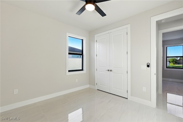 1912 SW 12th St, Cape Coral, FL 33991 - unfurnished bedroom with a closet, baseboards, and ceiling fan
