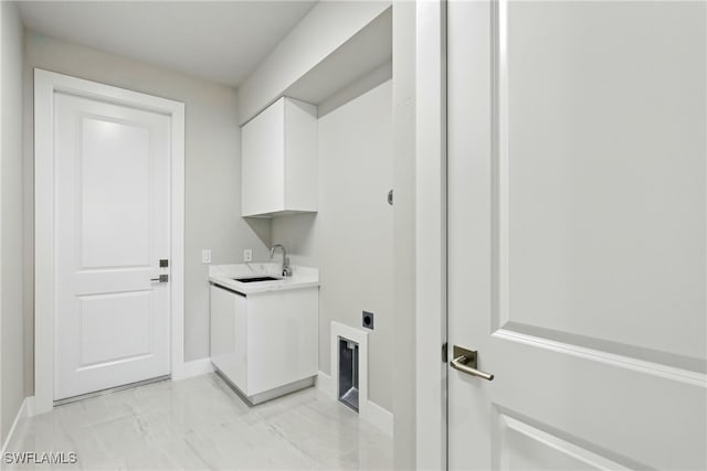 1912 SW 12th St, Cape Coral, FL 33991 - washroom featuring baseboards, hookup for an electric dryer, cabinet space, a sink, and marble finish floor