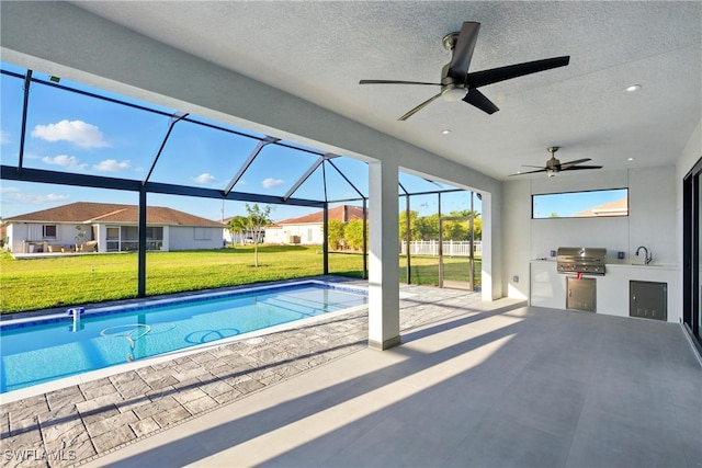 1912 SW 12th St, Cape Coral, FL 33991 - outdoor pool with ceiling fan, an outdoor kitchen, a yard, a lanai, and a patio area
