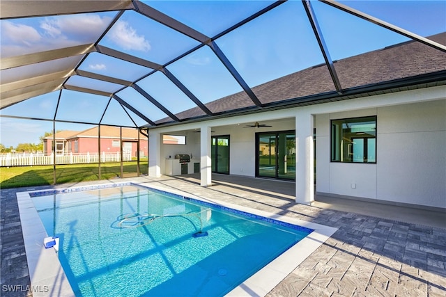 1912 SW 12th St, Cape Coral, FL 33991 - pool featuring area for grilling, a ceiling fan, fence, a lanai, and a patio area