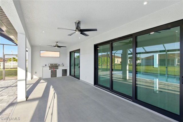 1912 SW 12th St, Cape Coral, FL 33991 - view of patio with glass enclosure, a ceiling fan, fence, area for grilling, and grilling area