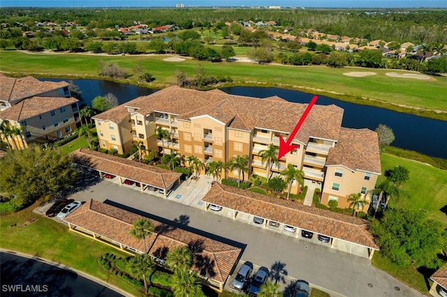 birds eye view of property featuring a water view and golf course view