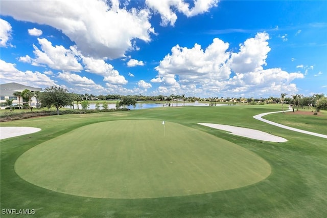 view of community with golf course view and a water view