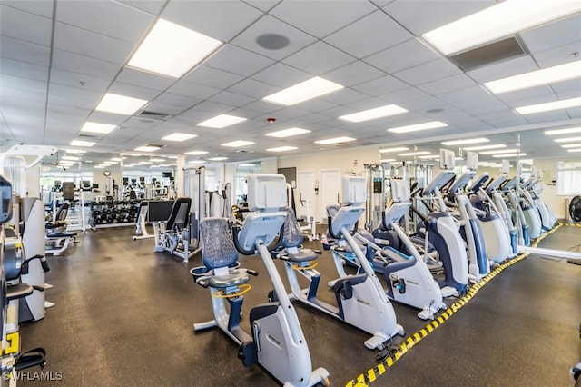 workout area featuring a drop ceiling and visible vents