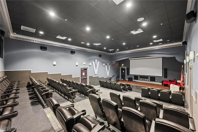 home theater room featuring visible vents and a drop ceiling