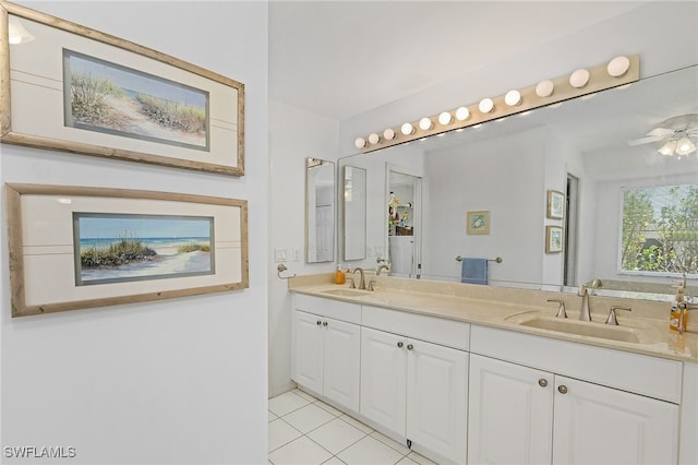 2810 Teal Ct, Saint James City, FL 33956 - full bath with double vanity, ceiling fan, a sink, and tile patterned flooring