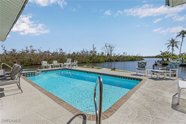 2810 Teal Ct, Saint James City, FL 33956 - view of swimming pool with a patio, a water view, and a pool with connected hot tub
