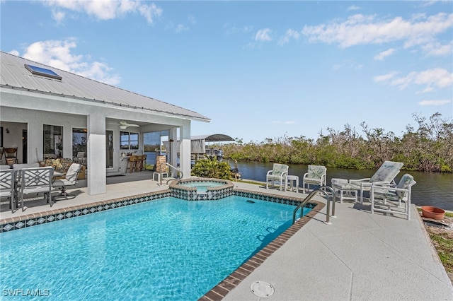 2810 Teal Ct, Saint James City, FL 33956 - view of swimming pool featuring a patio, a water view, a pool with connected hot tub, and a ceiling fan